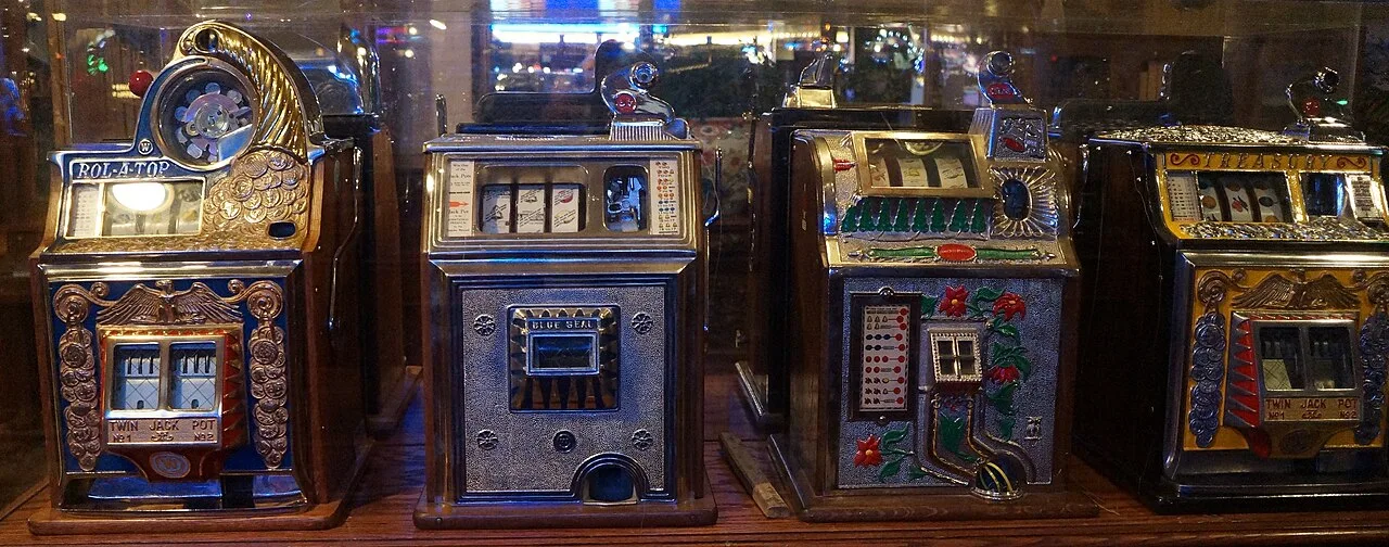 A row of vintage mechanical slot machines